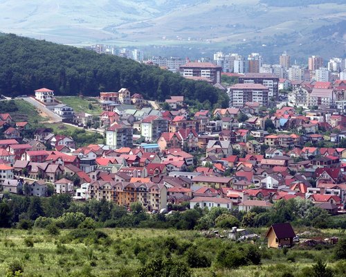 A view of urban business area in Cluj-Napoca with wide sidewalks and green pathways